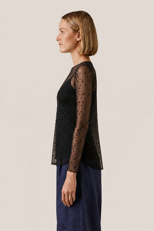 Top transparent à pois floqués noir, vue de profil
